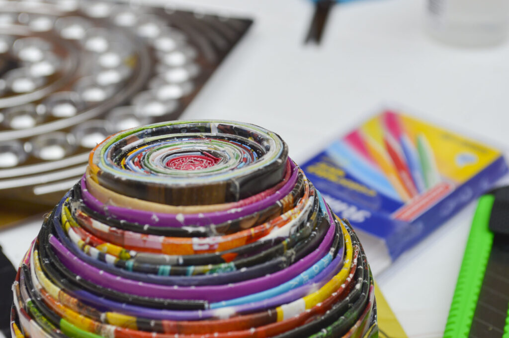 A bowl made from folded magazine paper