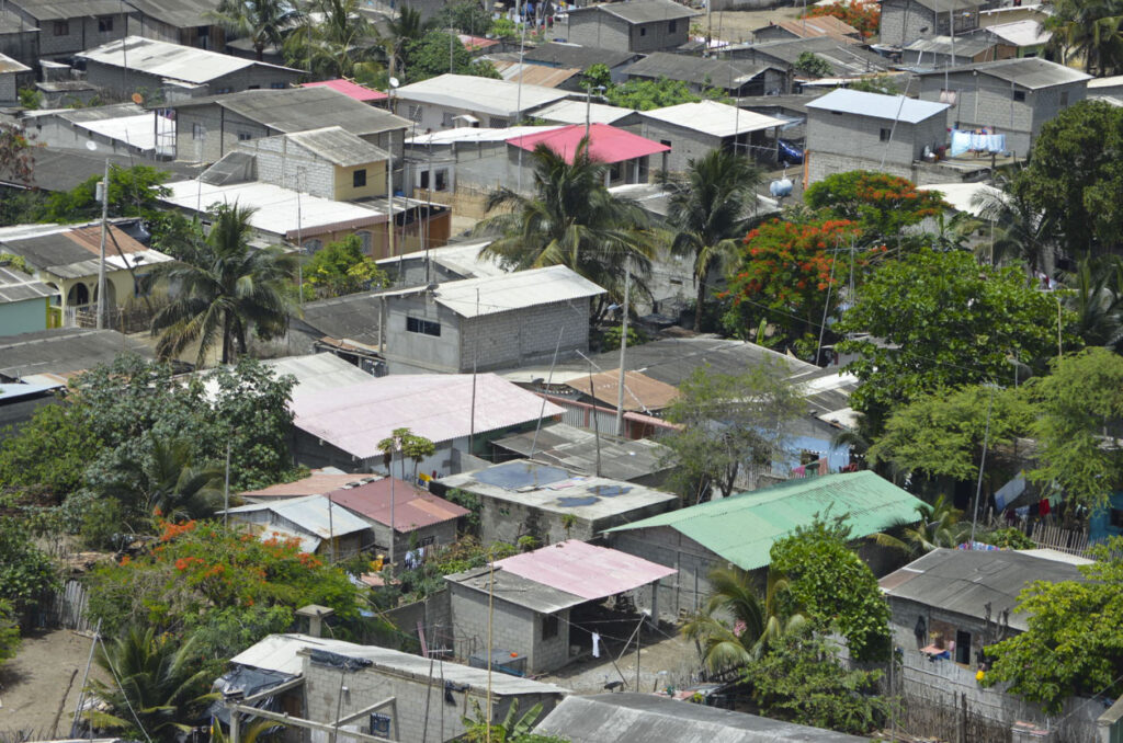 An aerial view of Palmar, Ecuador with colorful roofs visible